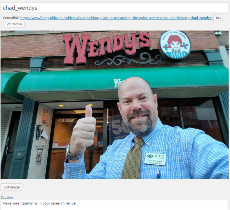 a picture of Chad in front of Wendy's